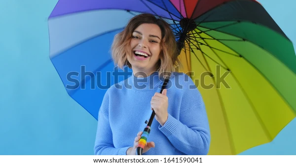 rainbow-umbrella-portrait-happy-smiling-600w-1641590041